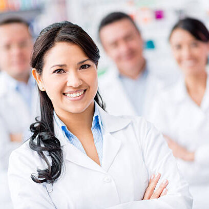 Group of doctors at the pharmacy looking happy